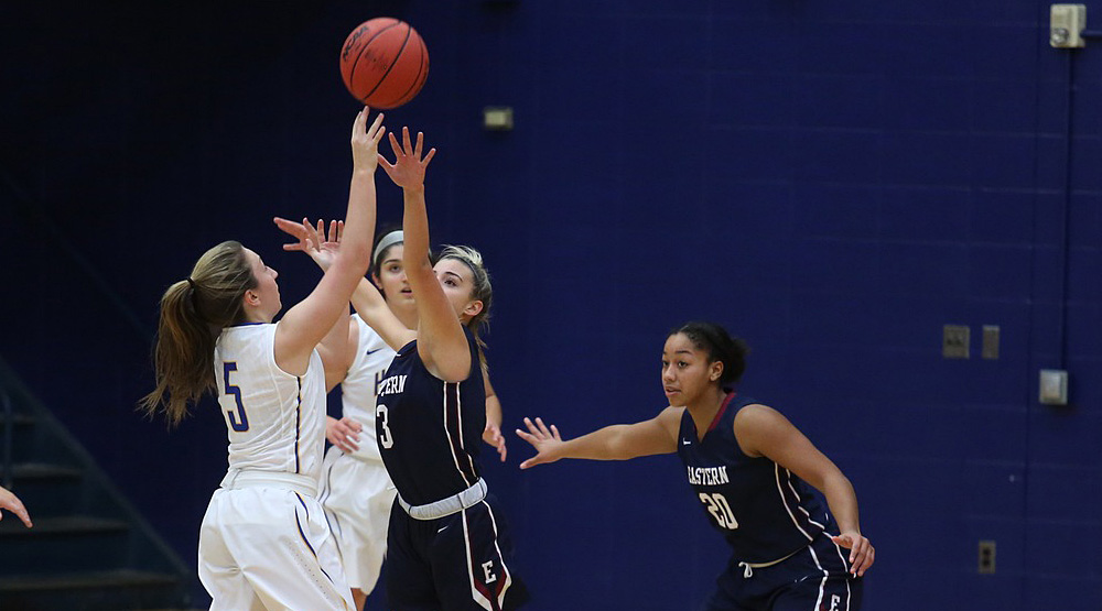 Eastern Connecticut file photo of women's basketball team on defense. 