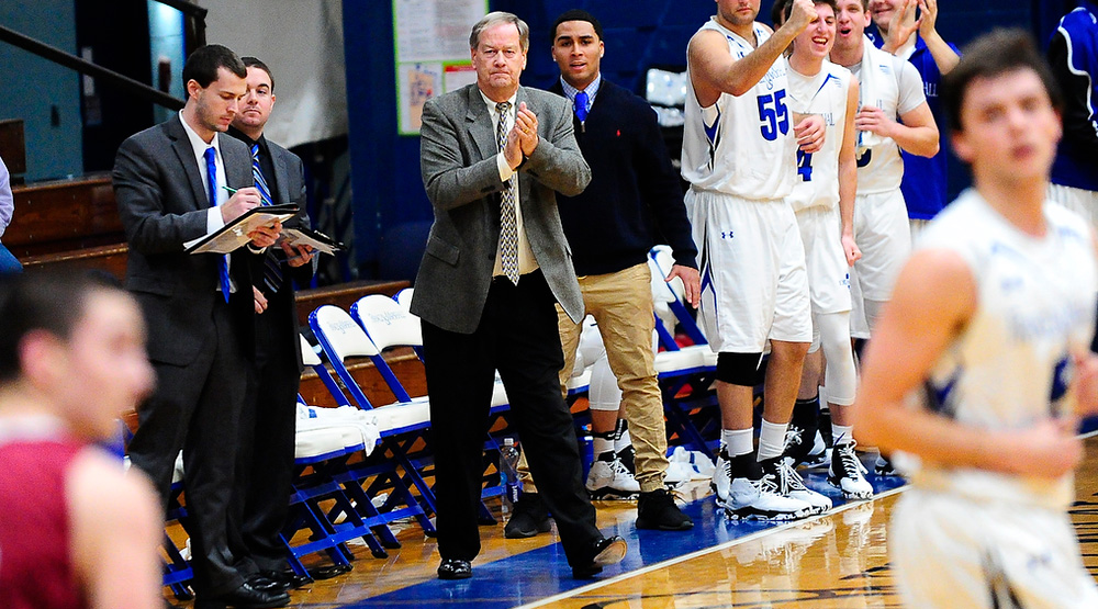 Glenn Robinson stands and claps for his time on the sidelines as the Diplomats get back on defense in a game against Muhlenberg. (F&M athletics photo)