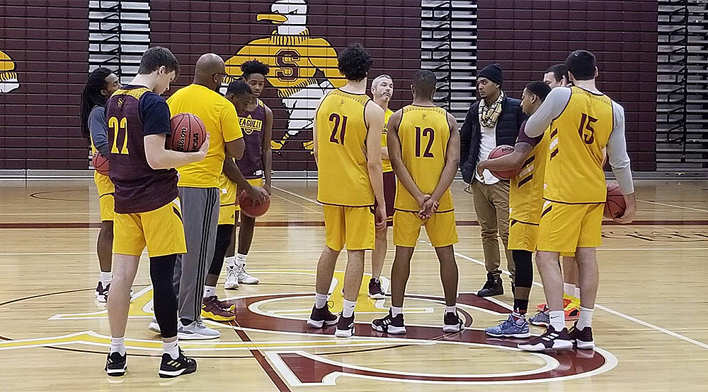 Salisbury men's basketball team at practice, with a new face in the middle.