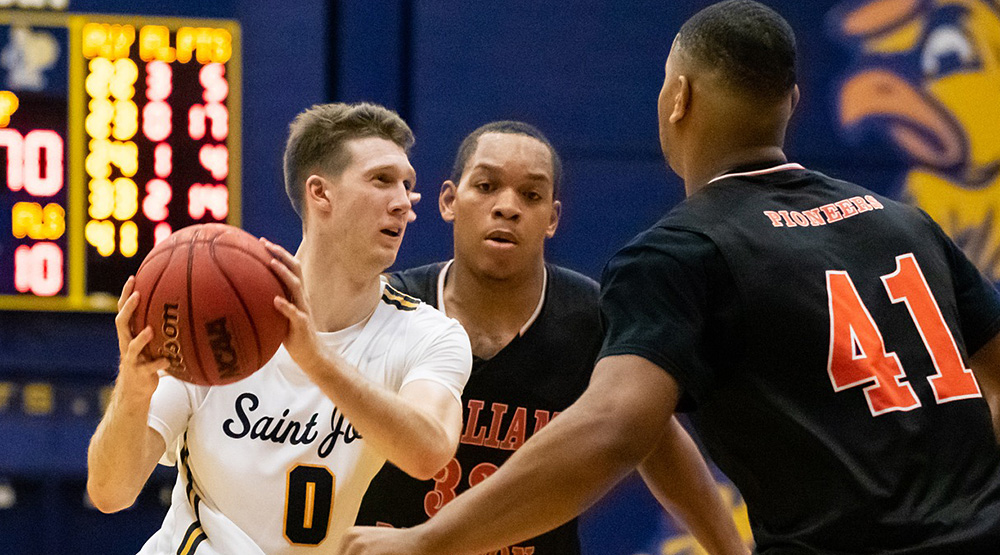 Ryan O'Neill works on the perimeter against two William Paterson players. (St. Joseph, Conn., athletics photo)