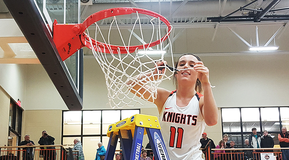 Katie Sommer cuts the net for Wartburg
