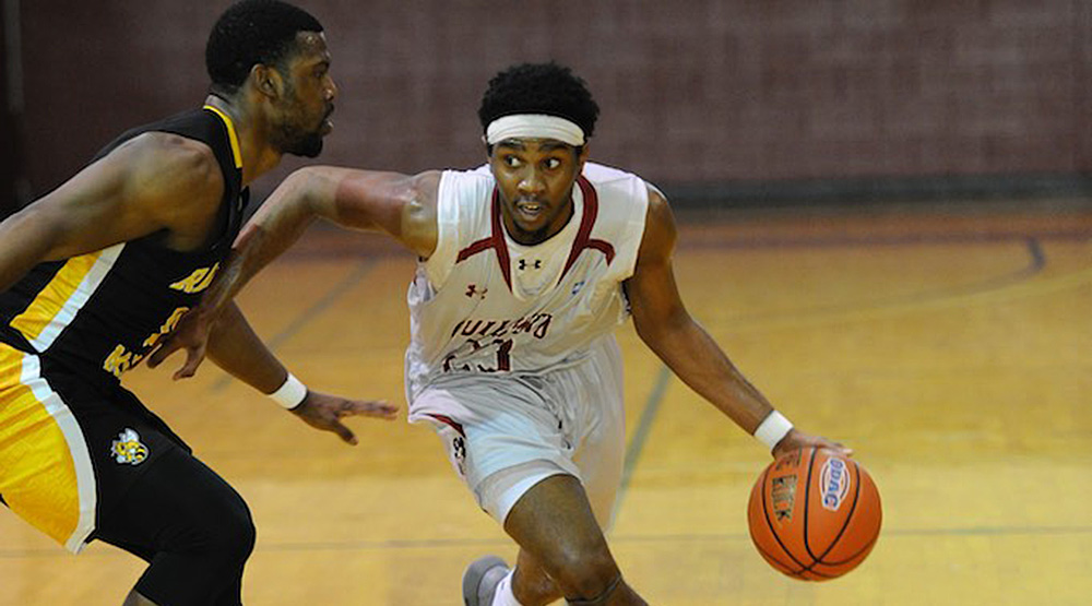 Marcus Curry dribbles up the floor against Randolph-Macon. (Guilford athletics photo by Andy Gore)