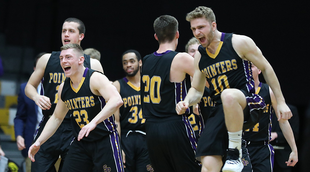 A whole bunch of UW-Stevens Point players celebrate late in the game during the Pointers' semifinal win at WIAC top seed UW-Oshkosh. (Photo by Steve Frommell, d3photography.com)